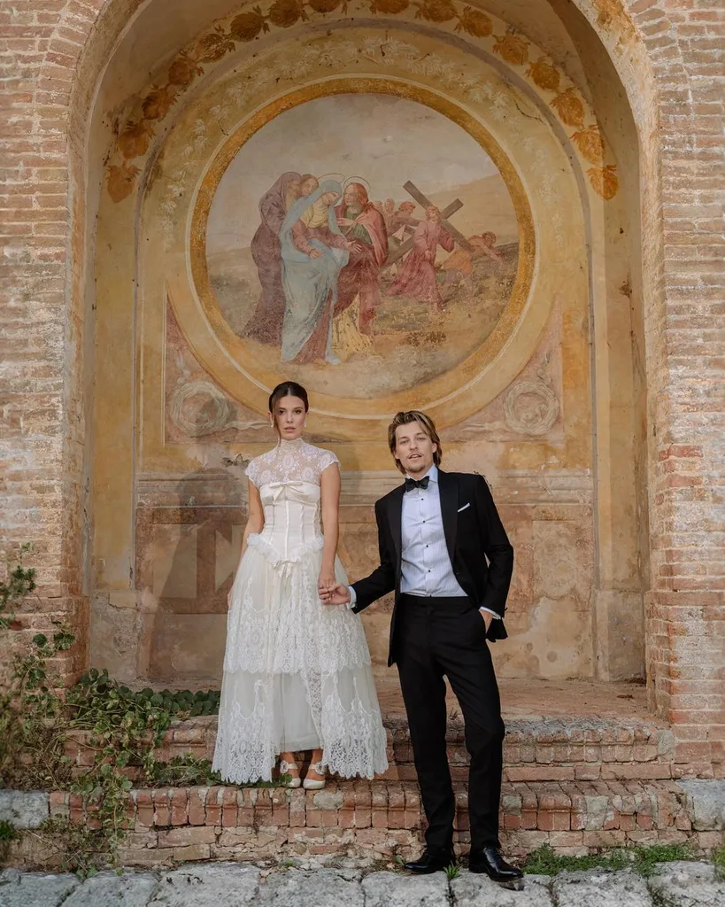 millie bobby brown wears tea-length lace wedding dress with jake bongiovi