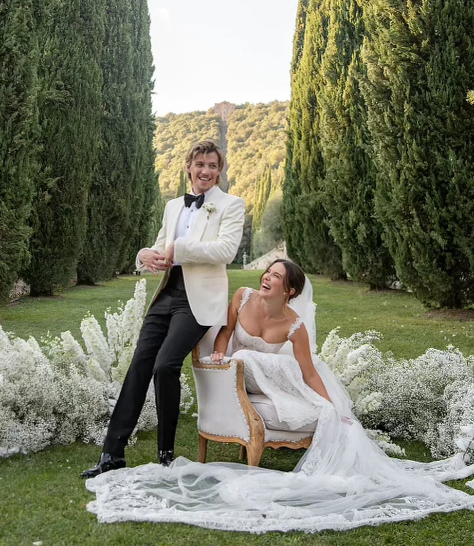 millie bobby brown and jake bongiovi pose for wedding photos in Tuscan gardens at wedding