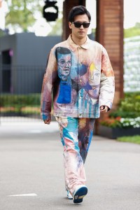 MELBOURNE, AUSTRALIA - 2023/03/30: Zhou Guanyu of China and Alfa Romeo F1 Team Stake walks through the paddock ahead of the Formula One Australian Grand Prix at the Albert Park Circuit in Melbourne. (Photo by George Hitchens/SOPA Images/LightRocket via Getty Images)