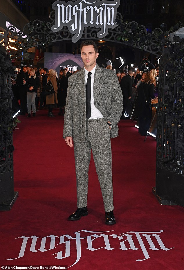 He cut a dapper figure in a stylish grey suit over a white shirt and black tie, while accessorising with a matching watch